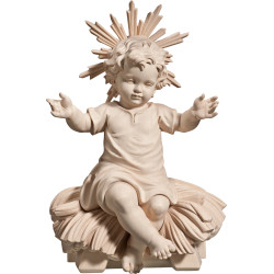 Niño Jesús vestido sentado en cuna